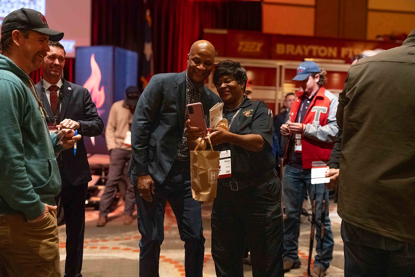 keynote speaker taking selfie with attendee