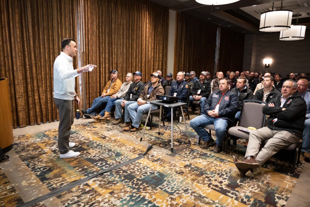 speaker at front of room