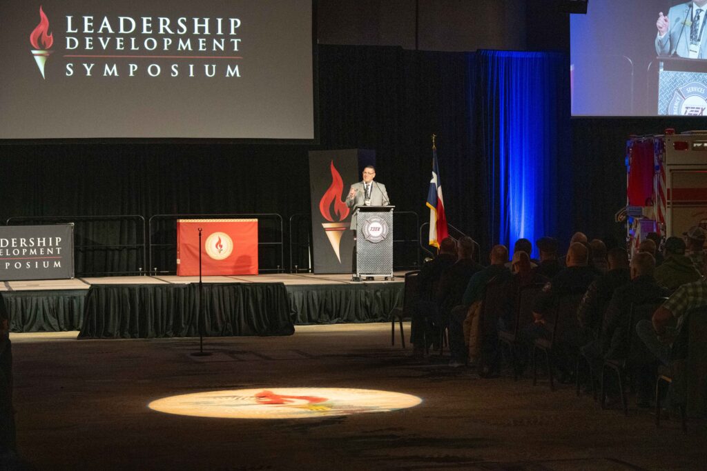 speaker on stage at podium