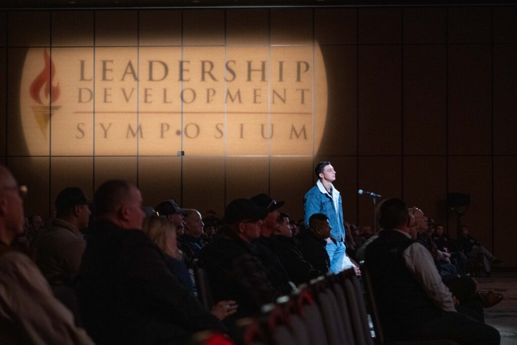 attendee at mic listens to the answer