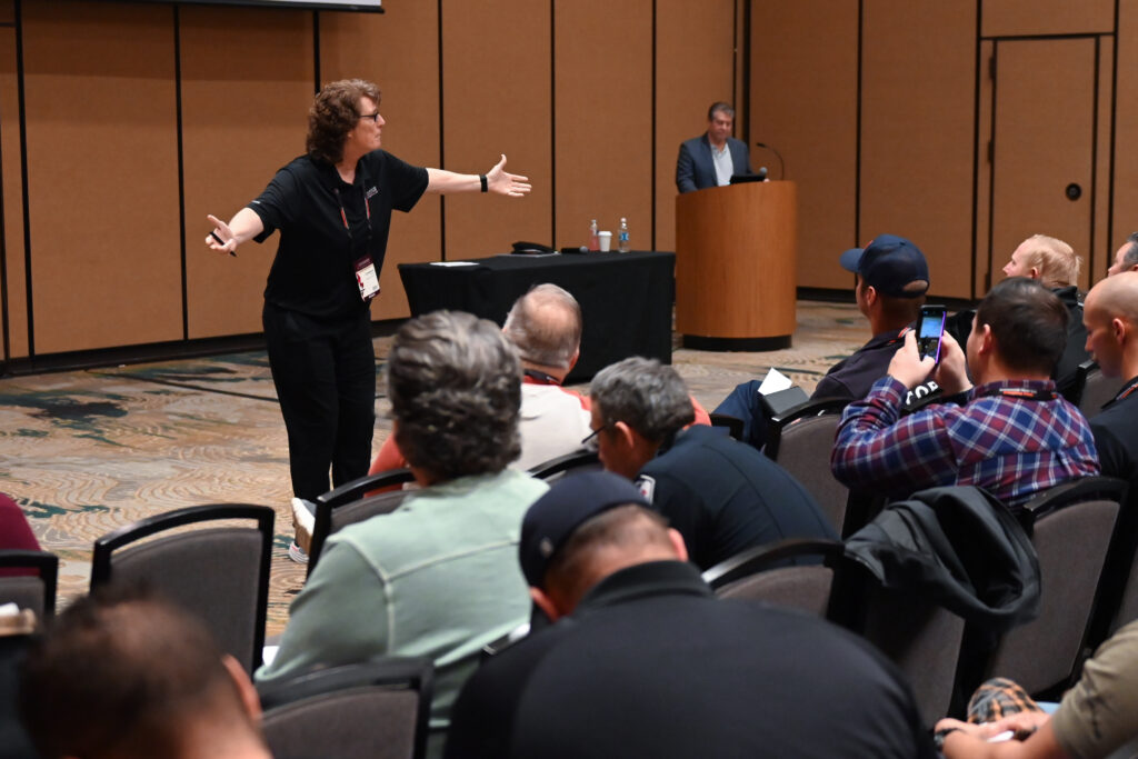 speaker at front of room