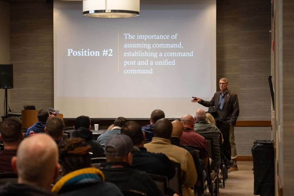 speaker at front of room